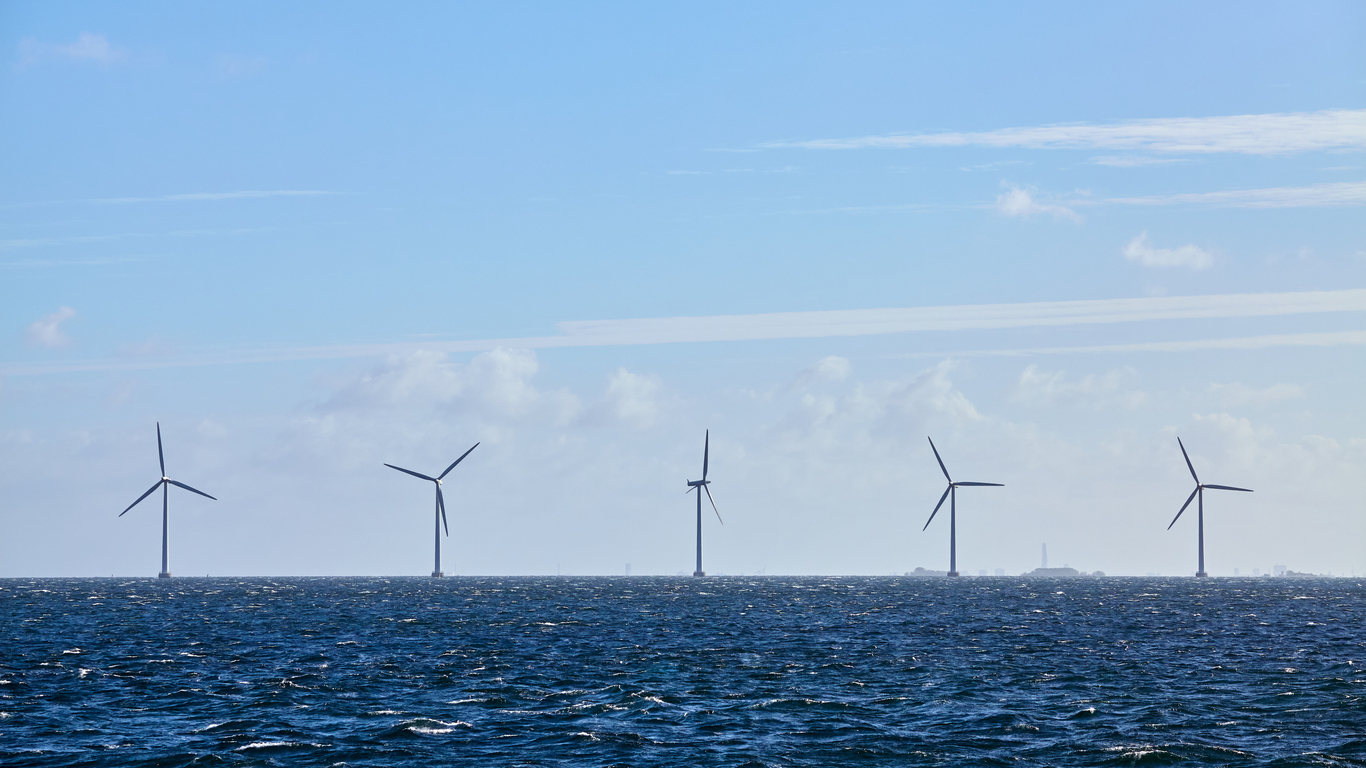 Row of offshore wind turbines.